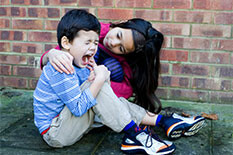 Picture of a person comforting a child